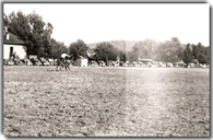 Cars around rodeo arena 1940